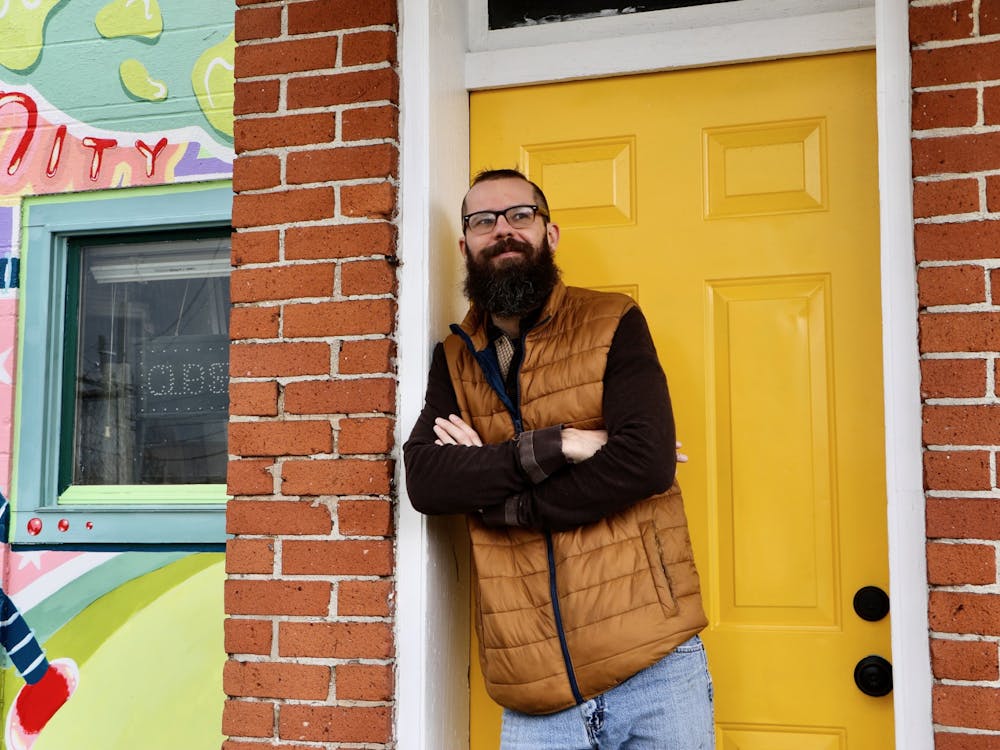 Kory Gipson, co-owner of The Common Market in Muncie, stands outside his storefront April 1. After purchasing the property in 2016, Gipson said his goal for the business is to strengthen his ties to the community. Grace Duerksen, DN