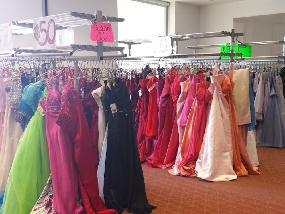 Donated prom dresses hang next to each other at Ball State's Fashion Merchandising Association's annual event, Cinderella's Closet. High schools students can purchase donated dresses for affordable prices. DN PHOTO TRISTAN BENNINGTON