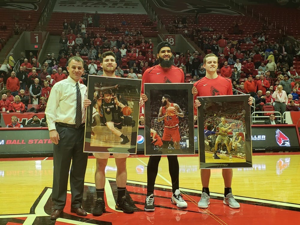 <p>Ball State Men's Basketball head coach James Whitford stands with seniors Tayler Persons, Trey Moses and Austin Nehls March 8, 2019, in Worthen Arena. The seniors were honored for senior night. <strong>Zach Piatt, DN</strong></p>