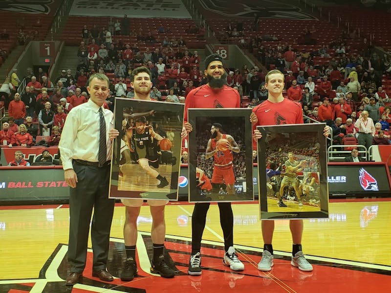 Ball State Men's Basketball head coach James Whitford stands with seniors Tayler Persons, Trey Moses and Austin Nehls March 8, 2019, in Worthen Arena. The seniors were honored for senior night. Zach Piatt, DN