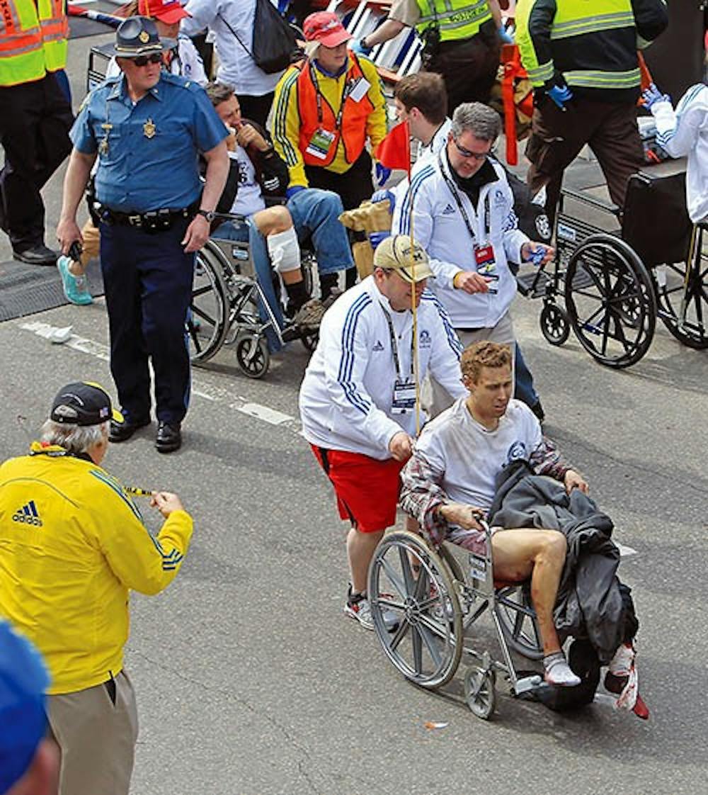 Victims of the bomb blast during the Boston Marathon are assisted in Boston on Monday. MCT PHOTO
