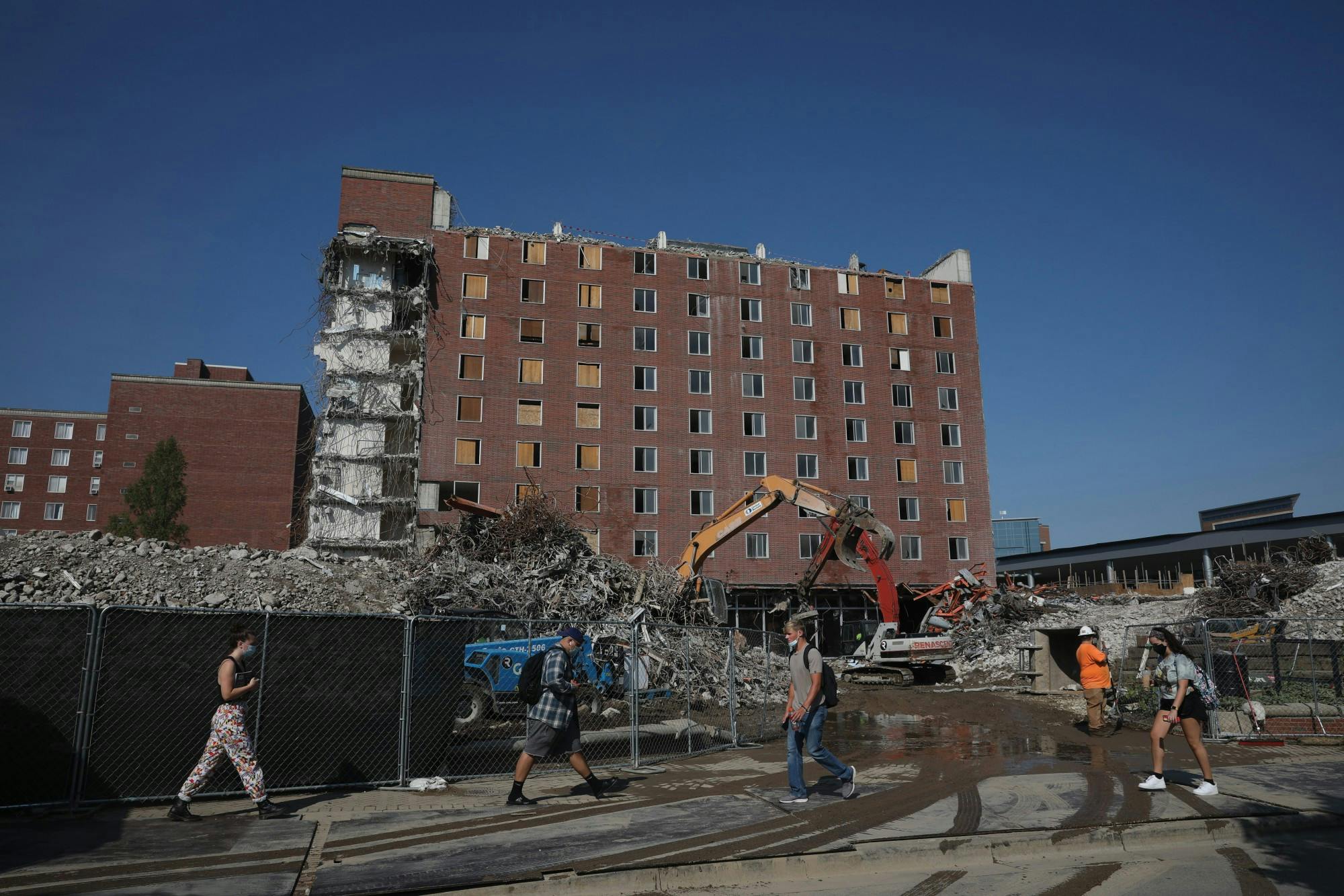 Students walk to and from class in front of the deconstruction of LaFollette Sept. 9, 2020, on McKinley Avenue. Starting in 2017, construction of the dorms is expected to be finished in 2021. Jacob Musselman, DN