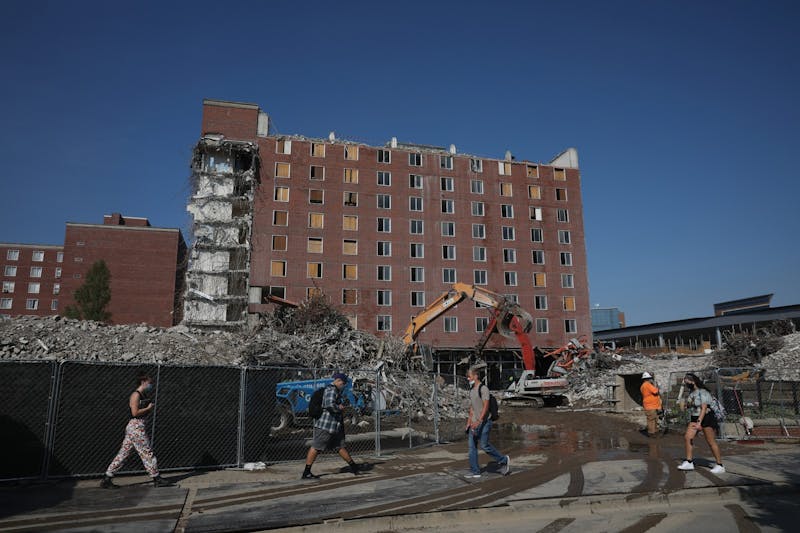 Students walk to and from class in front of the deconstruction of LaFollette Sept. 9, 2020, on McKinley Avenue. Starting in 2017, construction of the dorms is expected to be finished in 2021. Jacob Musselman, DN