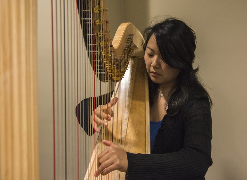 Annie King, a graduate assistant, has played the harp for twenty years. King teaches non-harp majors how to play the harp. 
