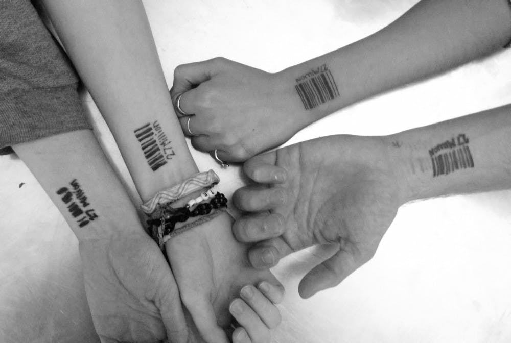 Members of the International Justice Mission show their barcodes. Their No Slave November campaign is to raise awareness for the estimated 27 million slaves in the world. DN PHOTO LAUREN CHAPMAN