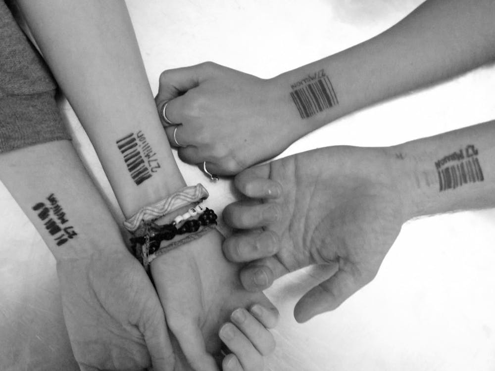 Members of the International Justice Mission show their barcodes. Their No Slave November campaign is to raise awareness for the estimated 27 million slaves in the world. DN PHOTO LAUREN CHAPMAN