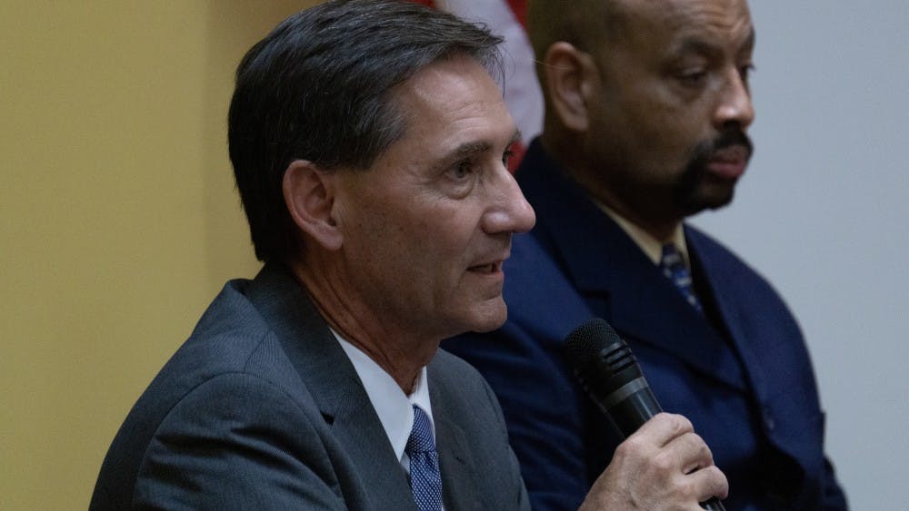 Muncie Mayor Dan Ridenour (R) answers questions from the audience at the Kennedy Library on September 16. Ridenour was one of three candidates who answered questions from Muncie residents on topics of their choice. John Lynch, DN.