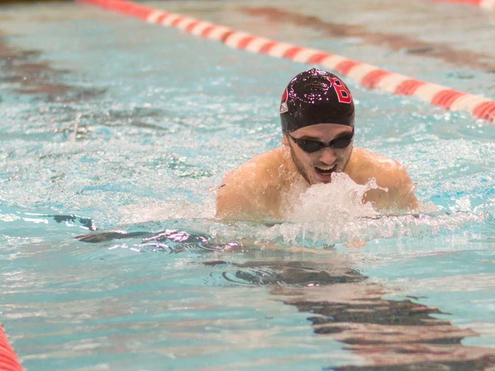 Sophomore Spencer Ball swims the 200-yard IM during the meet against Eastern Michigan on Jan. 13 in Lewellen Pool. Ball finished first with a time of 2:02.41. Teri Lightning Jr., DN