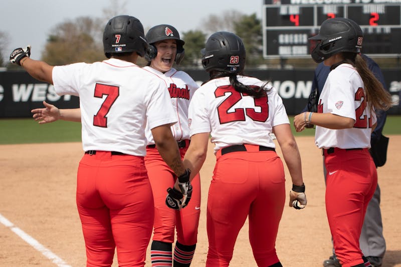 Ball State Cardinals cheer on graduate student infielder/outfielder Gabby Magnifico (second from left) after she hit a home run on April 23, 2021, at the Softball Field at First Merchants Ballpark Complex. The Cardinals won 4-2 against the Bobcats. Madelyn Guinn, DN