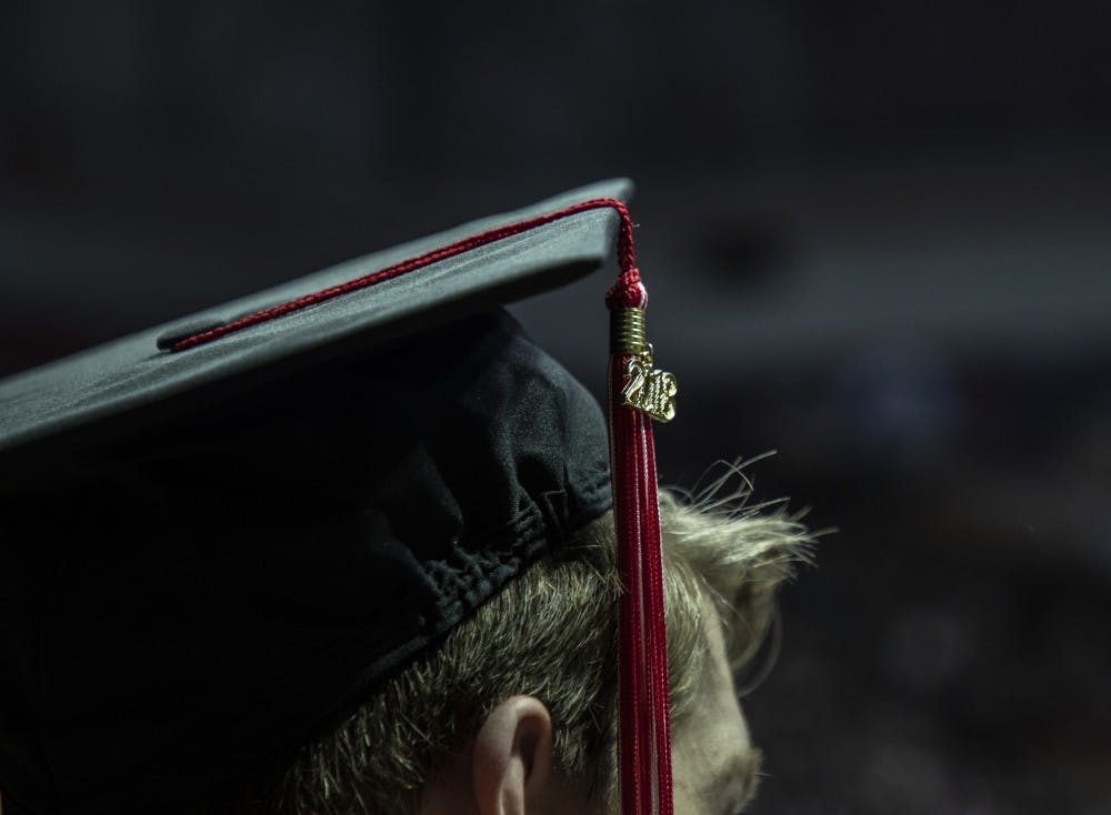 Tassels are moved from right to left during the Fall 2018 Commencement Dec. 15, 2018 at John E. Worthen Arena. Tassels and accessories indicate classes and certain accomplishments. Rebecca Slezak, DN