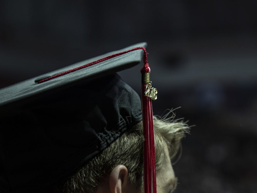 Tassels are moved from right to left during the Fall 2018 Commencement Dec. 15, 2018 at John E. Worthen Arena. Tassels and accessories indicate classes and certain accomplishments. Rebecca Slezak, DN