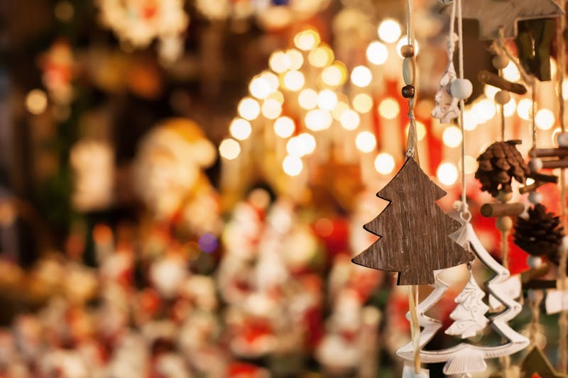 christmas decoration tree in the shop, winter street market in Europe by night