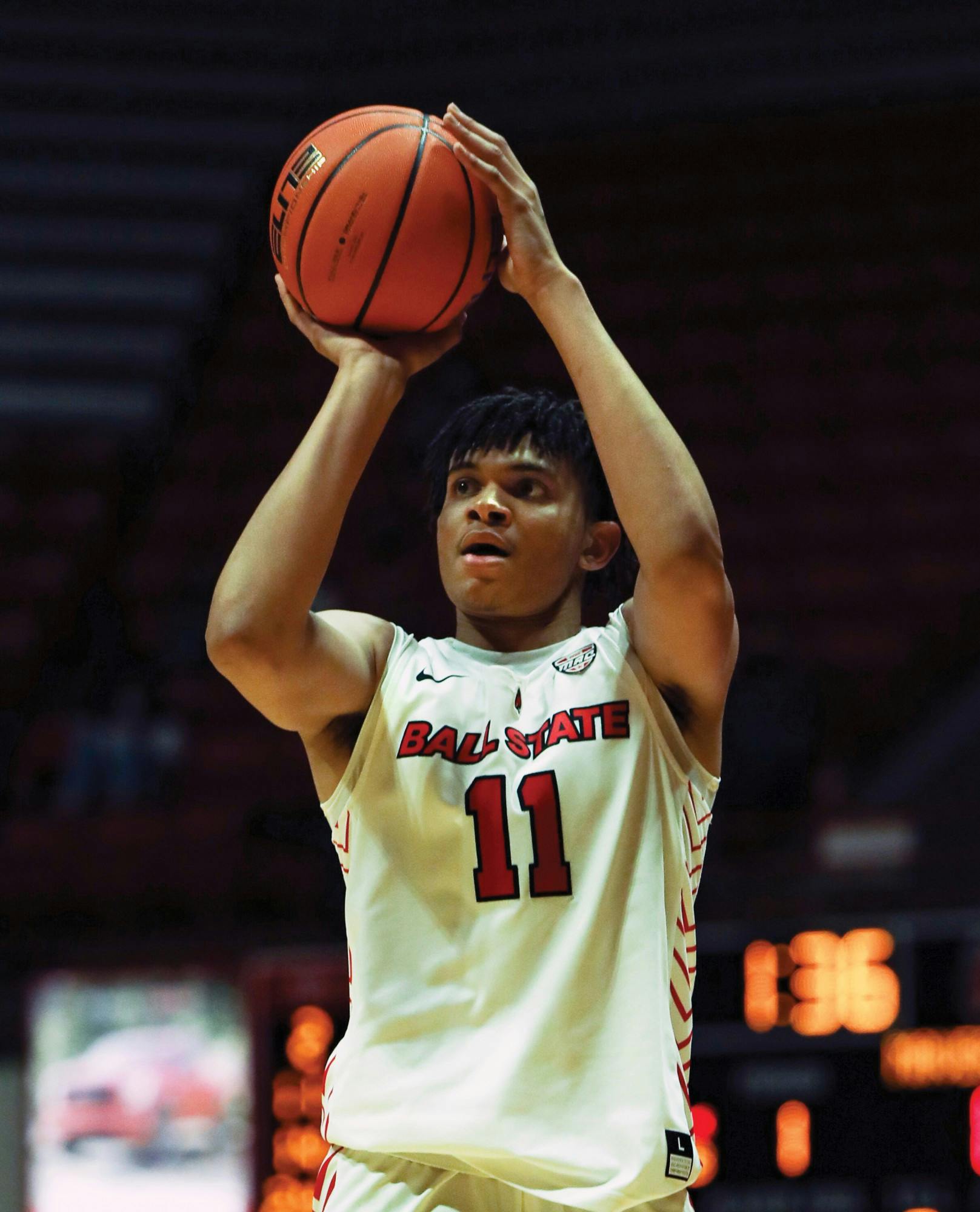 Freshman forward Basheer Jihad shoots for three from the arch against Omaha at Worthen Arena Nov. 13. Jihad had 9 points for the Cardinals against Omaha. Jacy Bradley, DN