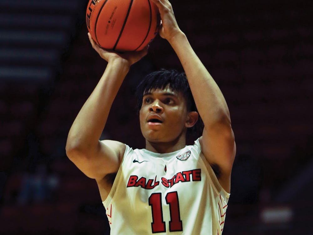 Freshman forward Basheer Jihad shoots for three from the arch against Omaha at Worthen Arena Nov. 13. Jihad had 9 points for the Cardinals against Omaha. Jacy Bradley, DN