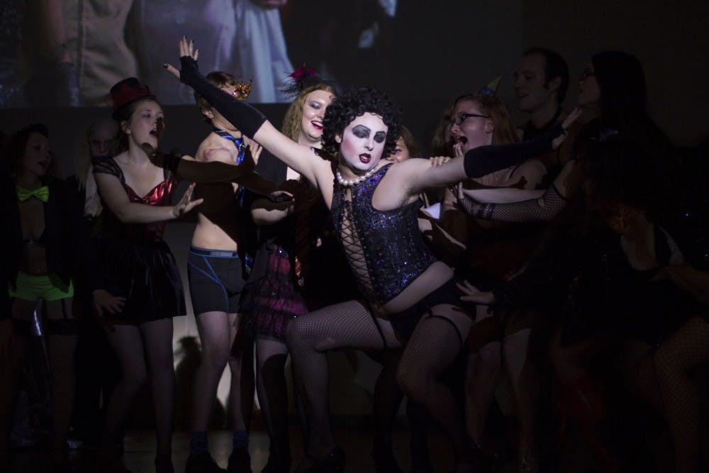 Cast members of "The Rocky Horror Picture Show" surround Dr. Frank N. Furter, played by Zachary Ryan Allen, during the performance on Oct. 31. DN PHOTO EMMA ROGERS