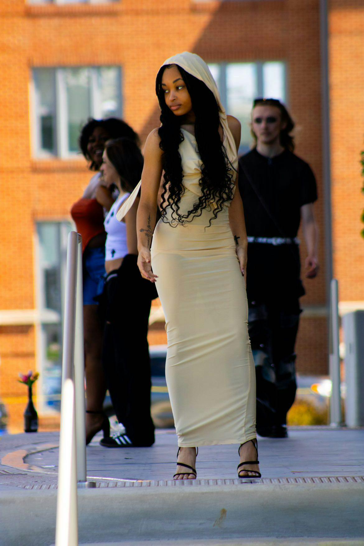 A model walking down the runway at the Brown Family Amphitheater on April 6, 2024. She is looking at the audience while down the stairs of the Brown Family Amphitheater. (Aaliyah Sansone, Photo Provided)