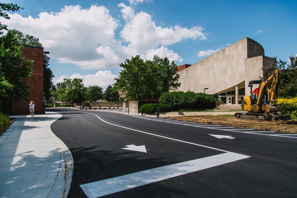 The road behind the parking garage and Pruis Hall has been complete. It was one of the temporary sidewalk closings occurring on campus. Reagan Allen // DN