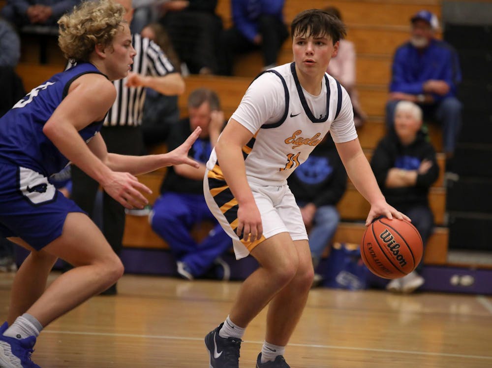 Delta freshman Ryan Lynch dribbles Dec. 14 during the Fieldhouse Classic at Muncie Central Fieldhouse. Zach Carter, DN.