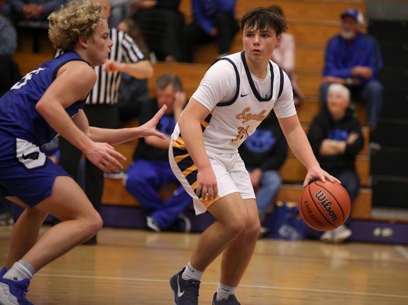 Delta freshman Ryan Lynch dribbles Dec. 14 during the Fieldhouse Classic at Muncie Central Fieldhouse. Zach Carter, DN.