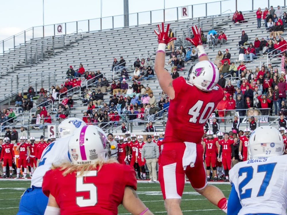 Senior tight end Dylan Curry jumps to catch the ball in the end zone during the football game against Georgia State on Oct. 17 at Scheumann Stadium. DN PHOTO ALAINA JAYE HALSEY