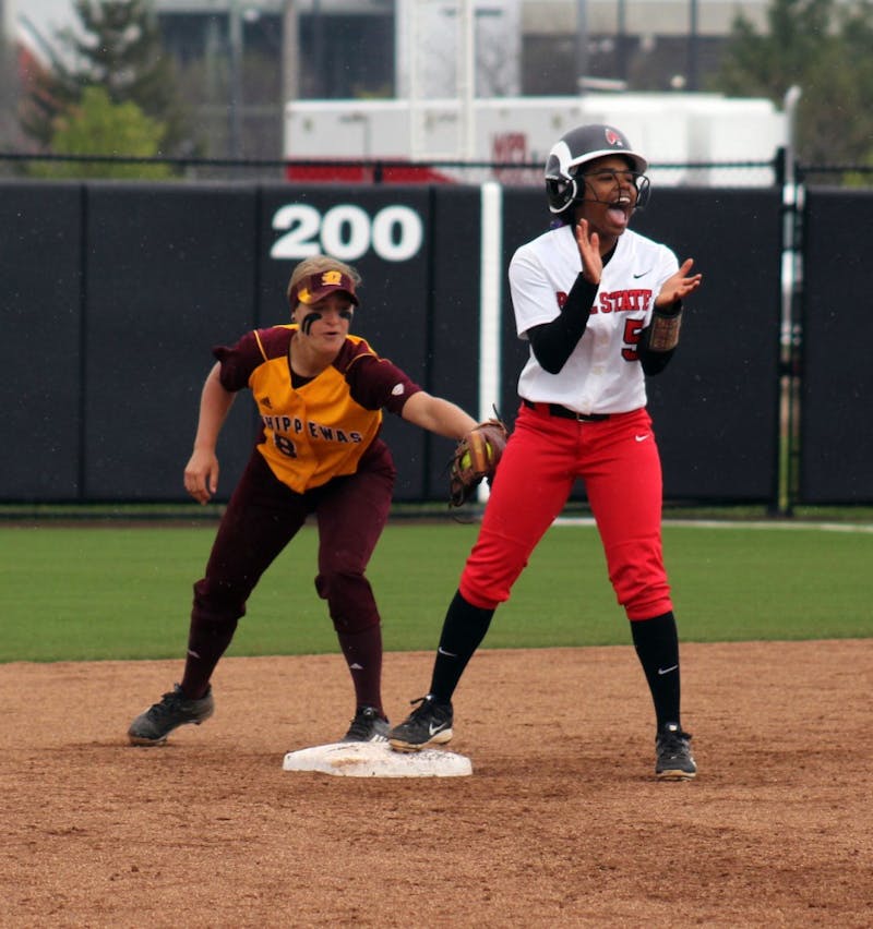 Freshman infielder Aeshia Miles attempts to rally her team as her opponent attempts to tag her out in the game against Central Michigan on Friday, April 22, 2016 at the Varsity Softball Complex. DN PHOTO ALLYE CLAYTON