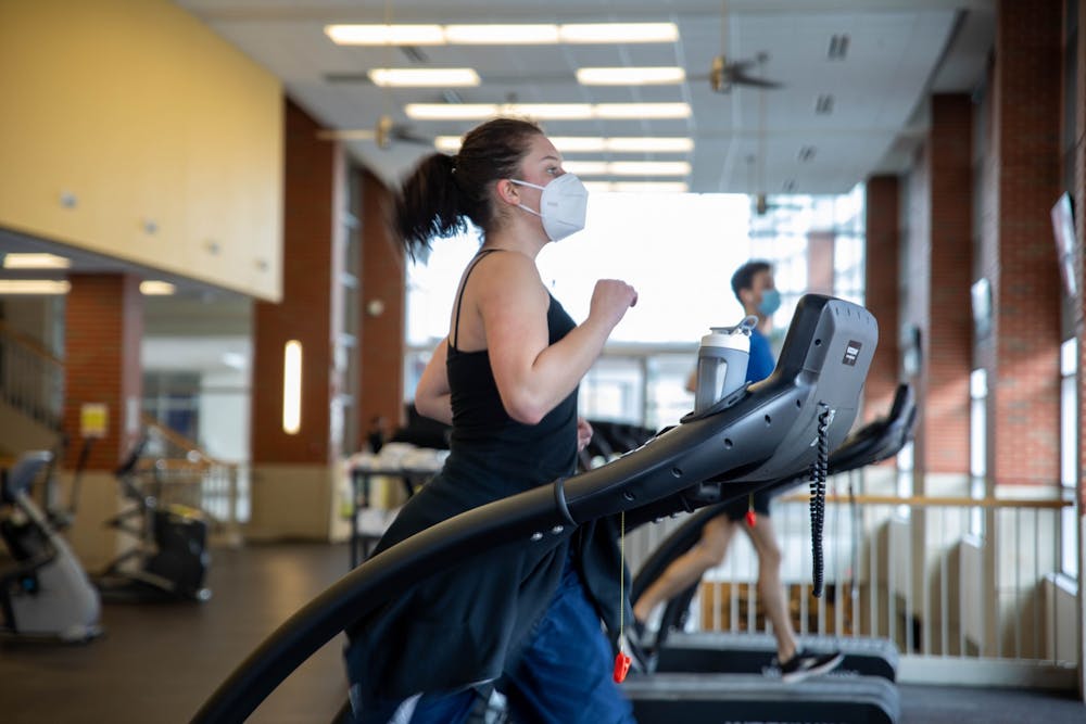 Junior theater major Emma Grow runs on the treadmill Feb. 22, 2021, at the Jo Ann Gora Student Recreation and Wellness Center. While social distancing will not be observed as strictly as in the 2020-21 school year, people will still be required to wear masks on campus in indoor facilities regardless of their vaccination status. Jaden Whiteman, DN File