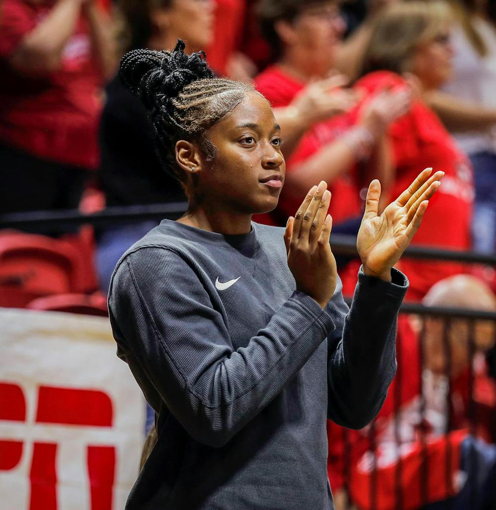 Redshirt sophomore outside hitter Aniya Kennedy cheers on her team from the sideline as they face Wright State Sept. 21 at Worthen Arena. Due to a minor knee injury Kennedy missed two matches against Butler and Wright State. Andrew Berger, DN 
