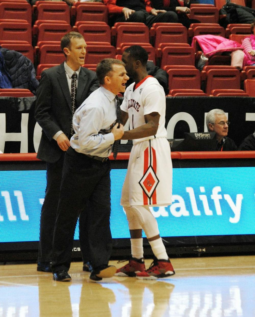 Head coach James Whitford is held back by Freshmen guard Francis Kiapway after his technical foul during the game against Buffalo on Feb. 4 at Worthen Arena. DN PHOTO ALLISON COFFIN