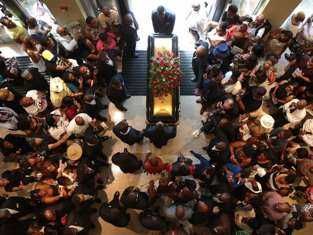 The casket of Michael Brown exits Friendly Temple Missionary Baptist Church at the end of his funeral on Aug. 25. MCT PHOTO