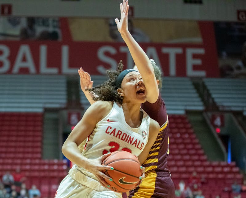 Junior forward Oshlynn Brown gets hit in the face while going in the paint Feb. 29, 2020, at John E. Worthen Arena. Brown had 17 points for the Cardinals. Jacob Musselman, DN