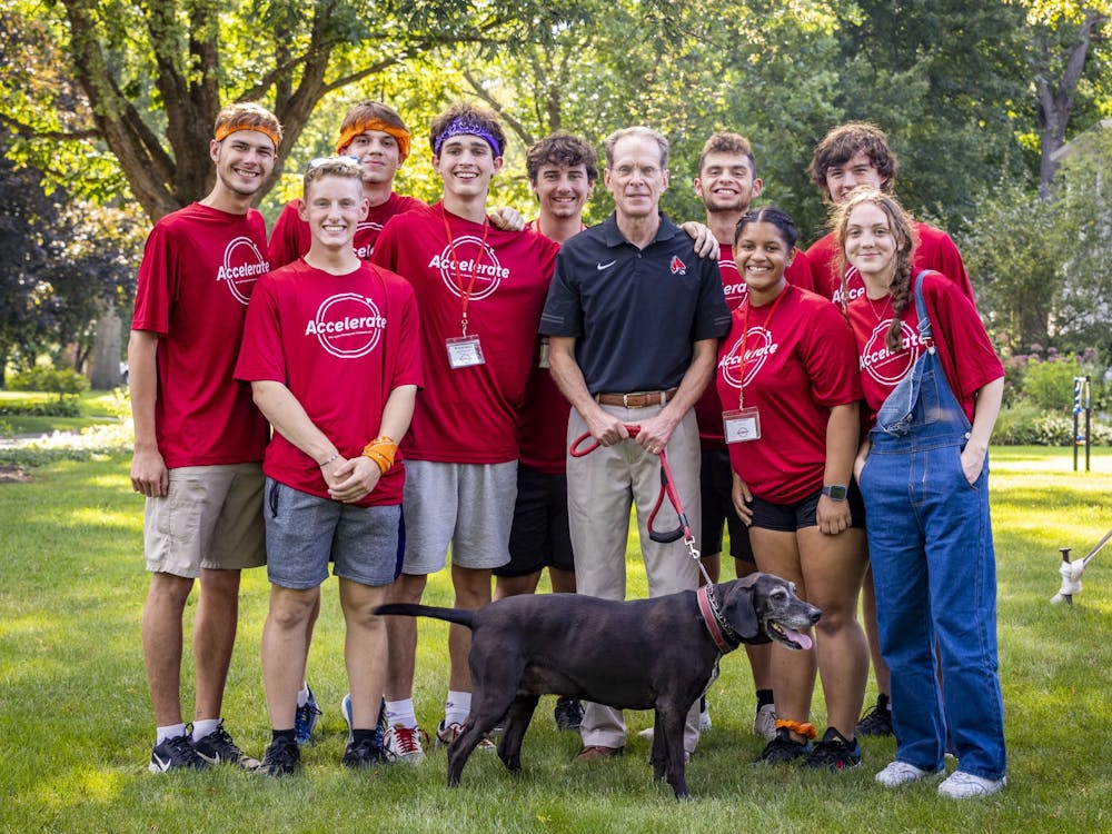 Ball State students pose for a photo with President Mearns at the Summer Bridge Accelerate dinner Aug. 16 at Bracken House. Samantha Blankenship, Ball State University, Photo Provided