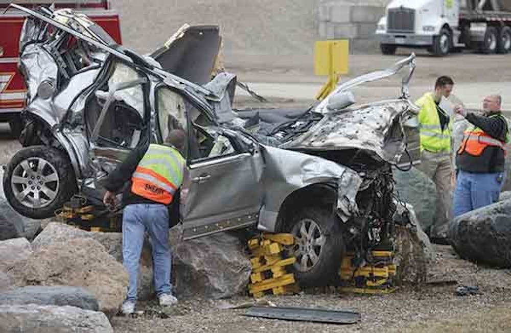 Two adults and one preteen were declared dead and three people were transported to nearby hospitals at the scene of a wreck involving an SUV on CR 600 West between CR 500 South and SR 67 Sunday evening. The SUV was headed southbound on CR 600 West when it left the road at a high rate of speed and collided with a retaining wall before crashing into a set of boulders. PHOTO COURTESY OF THE STAR PRESS AND JORDAN KARTHOLL