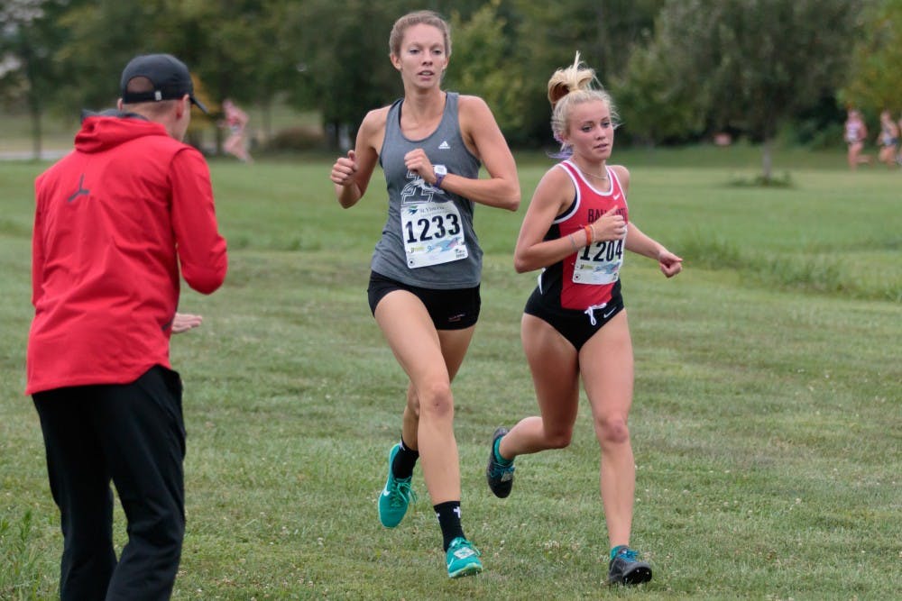 Runner Cayla Eckenroth fights for the lead during the Butler Twilight meet at Northview Church on Sept. 1, in Carmel, IN. Eckenroth finished second in the 5K with a time of 18:27.3. Kyle Crawford, DN File