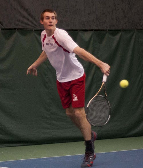 Freshman Ray Leonard returns a volley during his doubles match. DN PHOTO BOBBY ELLIS