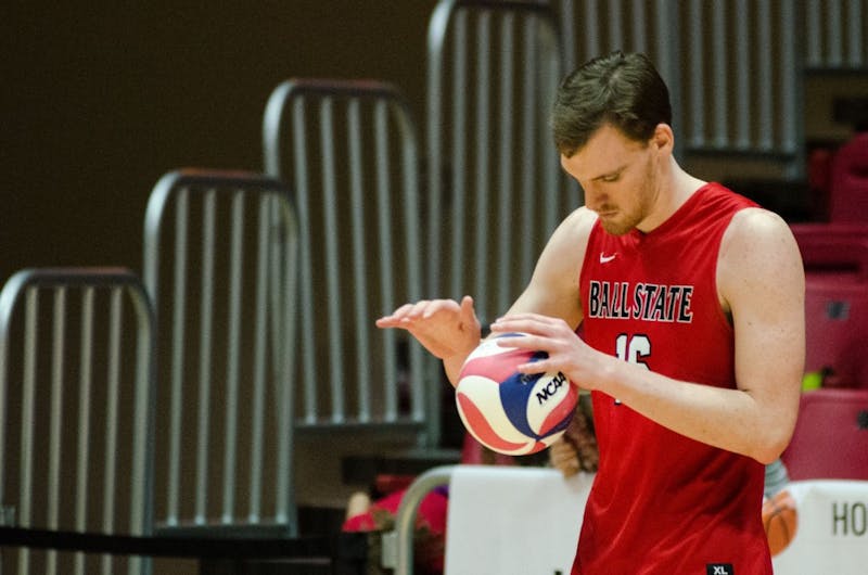 Senior middle attacker Matt Walsh prepares to serve the ball to Lewis University during a match on Feb. 16 in John E. Worthen Arena. Madeline Grosh, DN