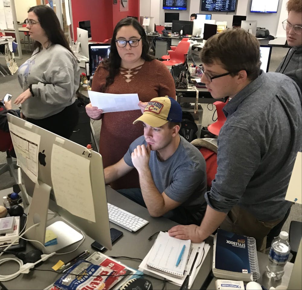 <p>Daily News staff members create the newspaper while reporting on Ball State University's plan in response to COVID-19 March 11, 2020, in the Unified Media Lab. <strong>Lisa Renze-Rhodes, Photo Provided</strong></p>