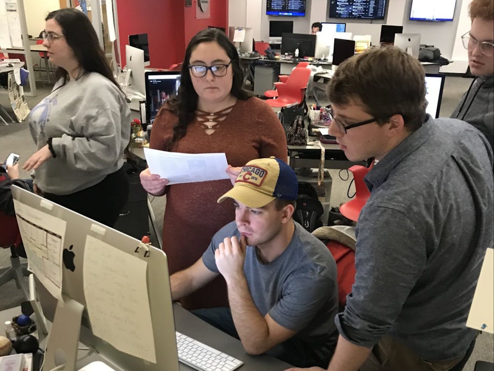 Daily News staff members create the newspaper while reporting on Ball State University's plan in response to COVID-19 March 11, 2020, in the Unified Media Lab. Lisa Renze-Rhodes, Photo Provided