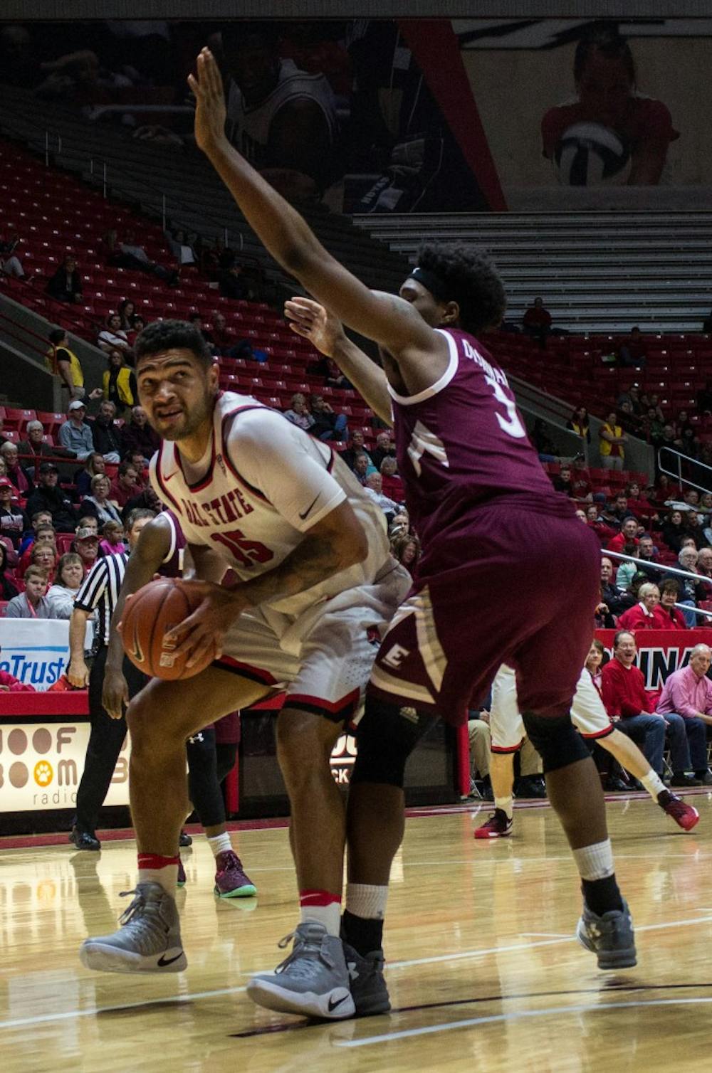 Ball State forward Franko House attempts to push past Eastern Kentucky forward DeAndre Dishman during the game on Dec. 10 in Worthen Arena. Ball State won 91-86 in overtime. Grace Ramey // DN