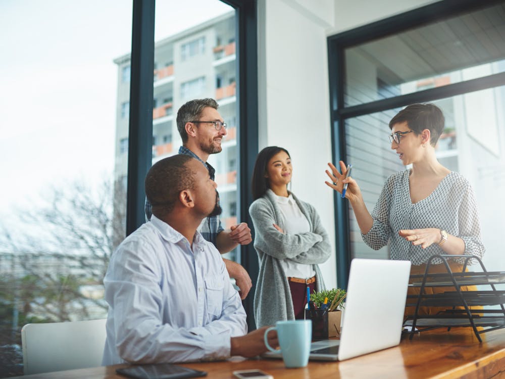 Cropped shot of a group of colleagues having a discussion in a modern office