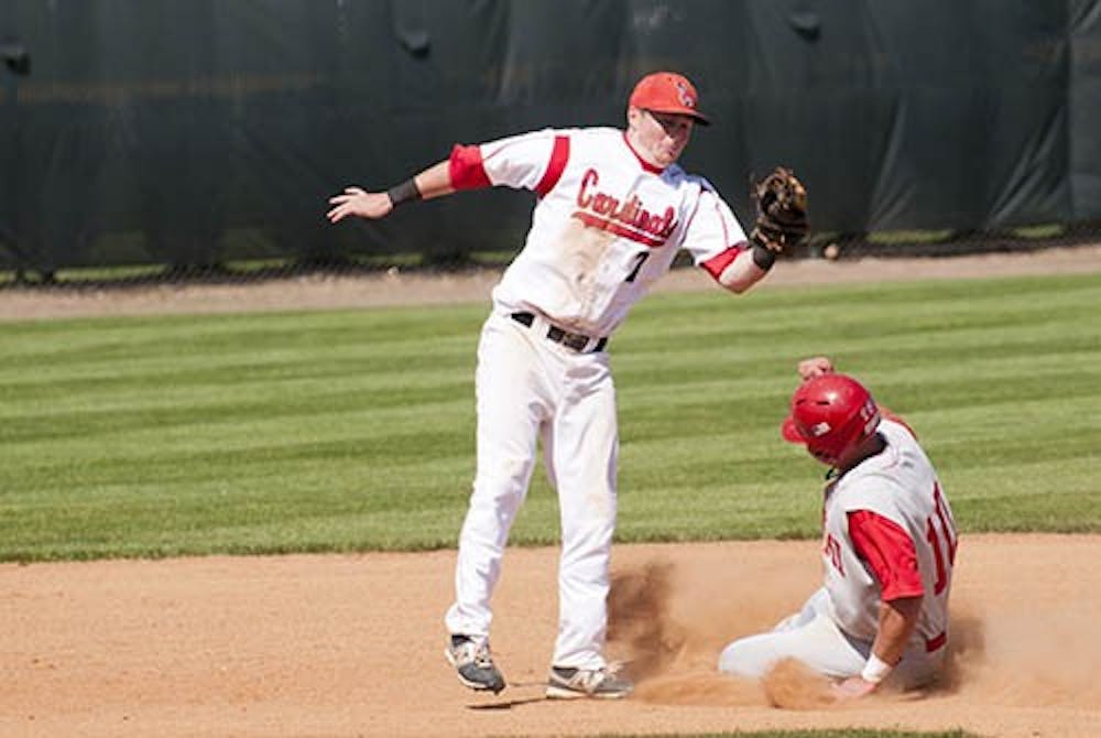 Sophomore Cody Campbell tags a Miami baserunner out at second during the game against Miami on April 8, 2012. Campbell won MAC West Player of the Week as a result of his recent performance in four games last weekend. DN FILE PHOTO BOBBY ELLIS