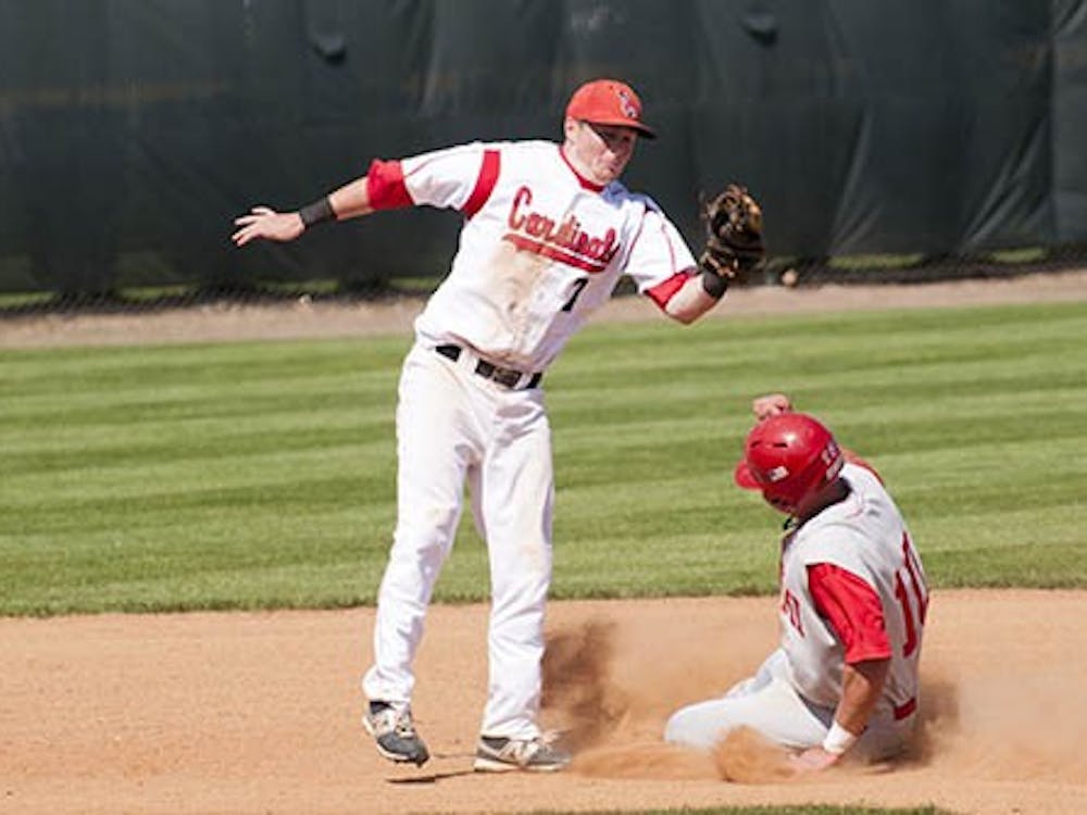 Sophomore Cody Campbell tags a Miami baserunner out at second during the game against Miami on April 8, 2012. Campbell won MAC West Player of the Week as a result of his recent performance in four games last weekend. DN FILE PHOTO BOBBY ELLIS
