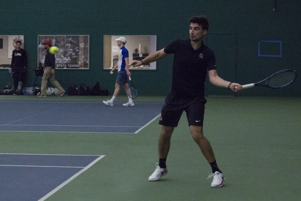 <p>Ball State men’s tennis player Marko Guzina prepares to return the ball during a singles set against Eastern Illinois University on Jan. 20 at the Northwest YMCA of Muncie. Guzina won his set. <strong>Briana Hale, DN</strong></p>