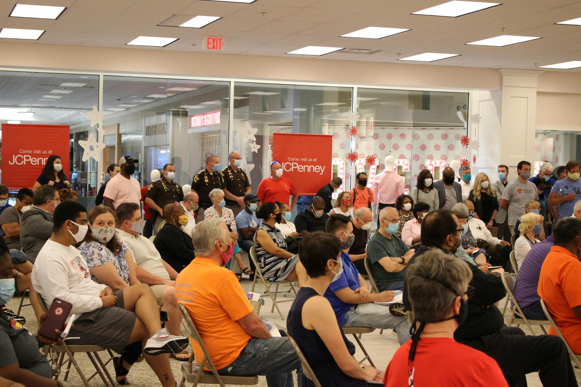 Police officers and citizens of Muncie listen to speakers at the community forum June 3, 2020, at Muncie Mall. Participants wore masks during the forum to prevent the spread of COVID-19. Mayor Dan Ridenour spoke at the meeting intended to address racial injustice in the community. “There is no place in the City of Muncie for prejudice, not now, not tomorrow, not ever,” he said. Jenna Gorsage, DN