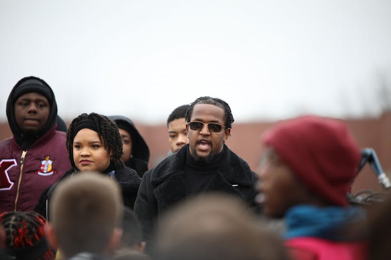 Kwesi Rogers speaks on stage at the walkout 11 a.m. Jan. 28. 2020, at University Green. Rogers questioned on stage why he and other members of the Black community have to demand respect when they deserve it. Demi Lawrence, DN