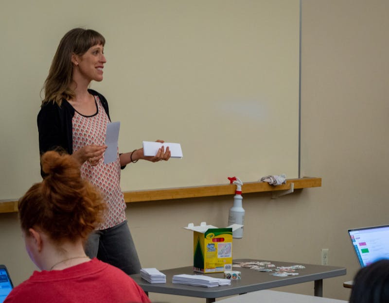 Ball State professor Kate Elliot talks to her class about creating bookmarks for United Way: Day of Action Sept. 1. Elliot is on the board of this foundation and is looking to introduce it to her students by having them participate in making inspirational bookmarks. Meghan Sawitzke, DN