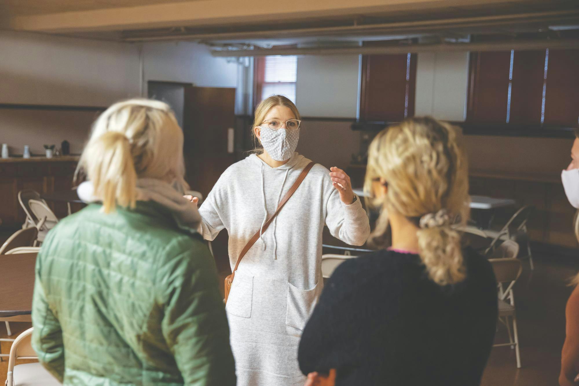  Associate Professor of Interior Design Sarah Anne Alfaro speaks with her students at Riverside United Methodists Church (now under new ownership and called Brea Church) during the Fall 2021 iteration of the Using Space in Places of Worship immersive learning project. The project combined interior design and construction management students to work as consultants for religious spaces. Ball State Immersive Learning, Photo Provided
