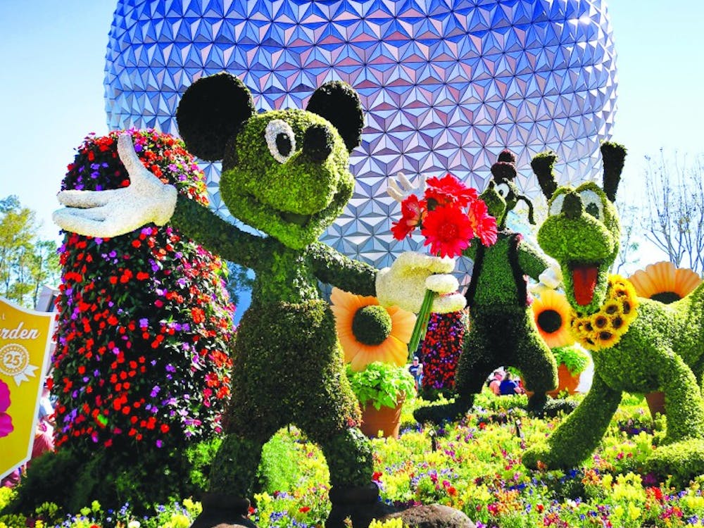 Mickey, Goofy and Pluto are among the topiaries that welcome guests at the entrance of the 2018 Epcot International Flower &amp; Garden Festival, March 2018. “Entrepreneurship A Disney Way” was written by Michael Goldsby and Rob Matthews, directors at the institute for entrepreneurship and free enterprise at Ball State. Joe Burbank, TNS PHOTO