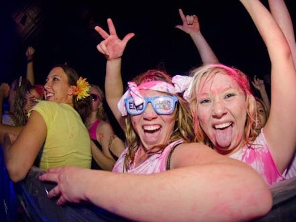 Two students take in the Life in Color concert. The event took place Nov. 10 in Worthen Arena. DN FILE PHOTO COREY OHLENKAMP