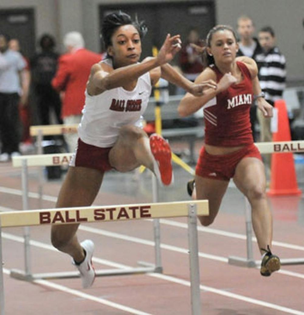 Senior Amber Williams competes in the 60-meter hurdles during the Ball State Quadrangular at the Field Sports Building Friday afternoon. DN PHOTO/ JOSH PECKLER