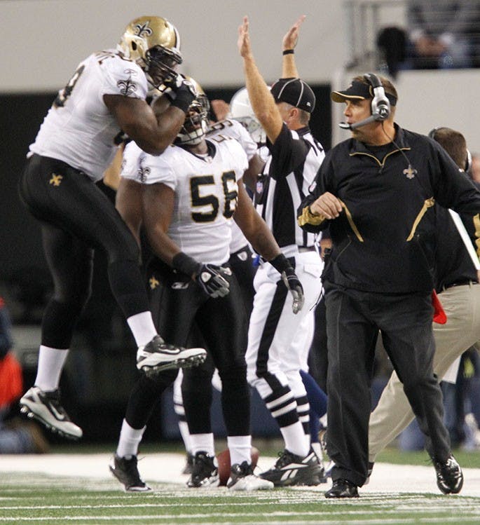 New Orleans Saints head coach Sean Payton and his team celebrate after the Saints defense stopped the Dallas Cowboys on a 4th-and-one attempt in the 2nd quarter, Thursday, November 25, 2010 in Arlington, Texas. (Ron Jenkins/Fort Worth Star-Telegram/MCT)